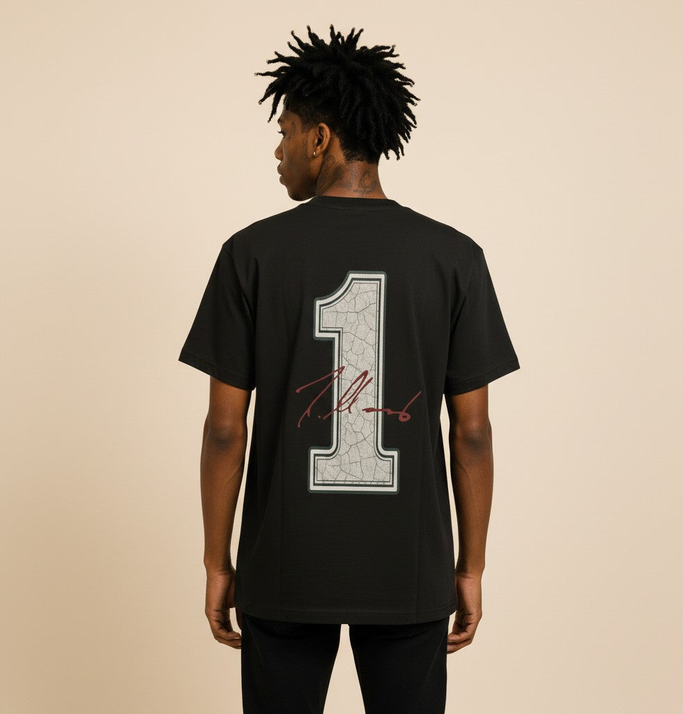Athlete Xclusive black cotton tee with cracked graphic of number 1 and autograph on back. Dri-Fit lining.