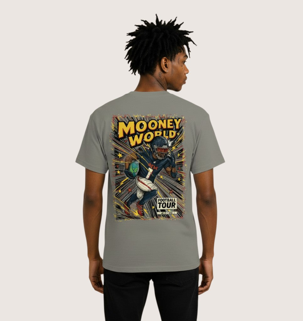 Athlete Xclusive Mooney World Football Tour graphic tee, grey, 100% cotton, featuring a comic-style illustration of a football player running with the ball.