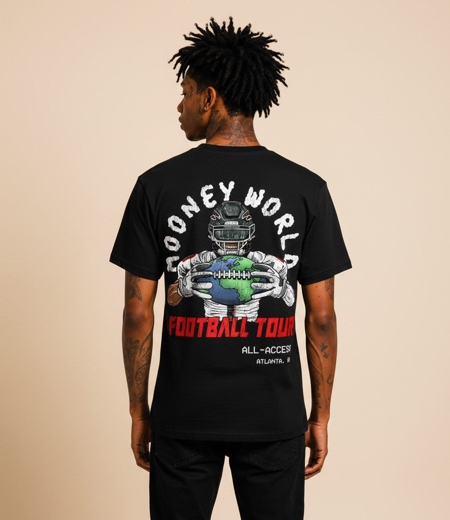 Athlete Xclusive black cotton t-shirt with a football player graphic holding a globe football, "MooneyWorld Football Tour All-Access Atlanta, GA" text.