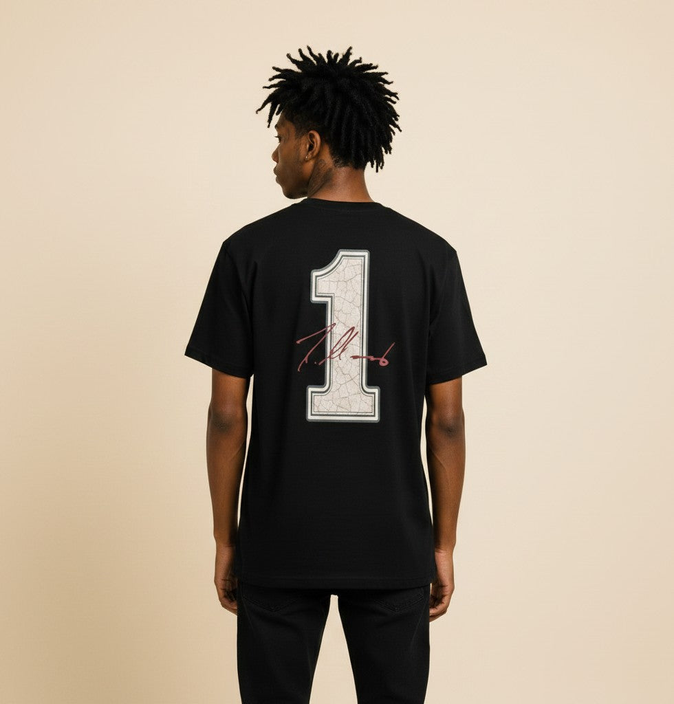 Athlete Xclusive black cotton t-shirt with a cracked white '1' graphic and red signature on the back.