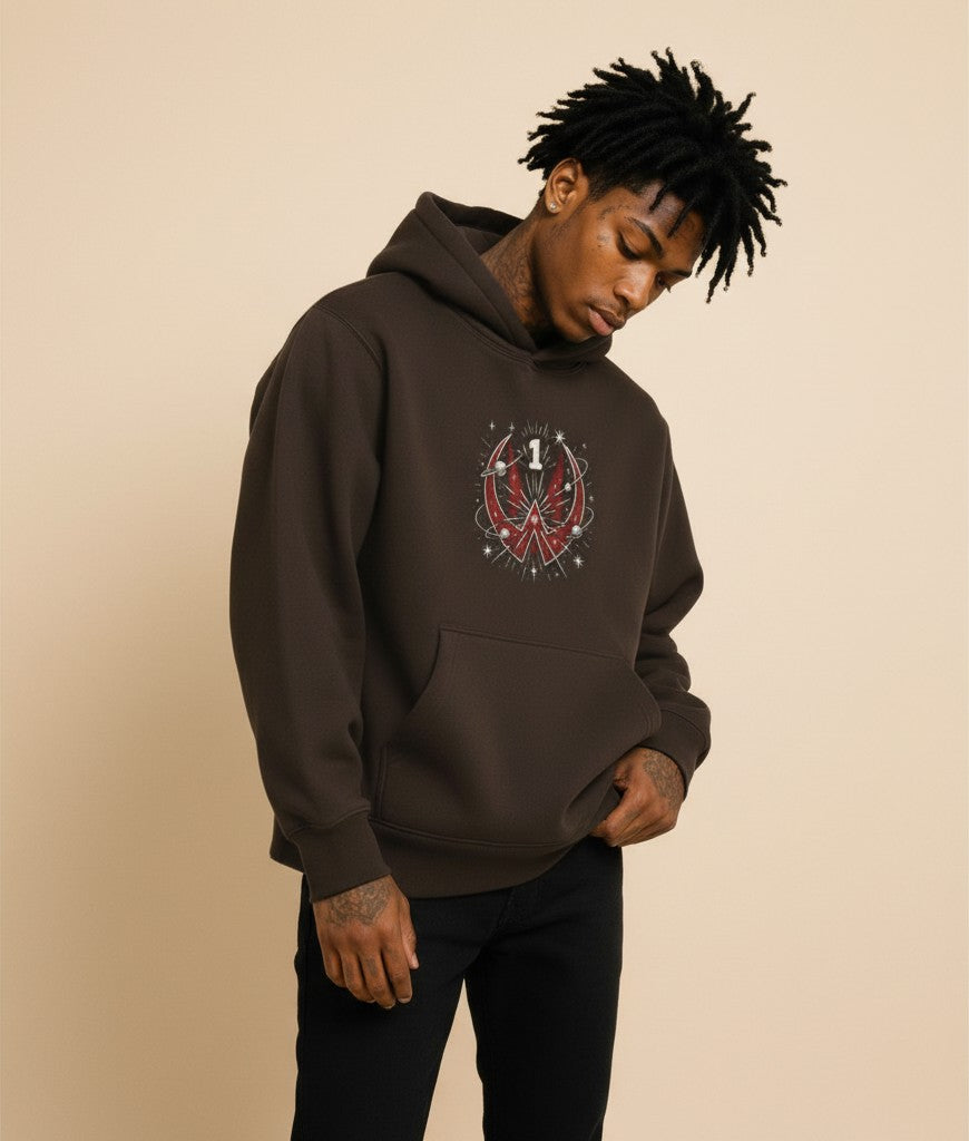 Athlete Xclusive Unleashed hoodie in dark brown, featuring a red cosmic graphic with planets and stars. Oversized fit.